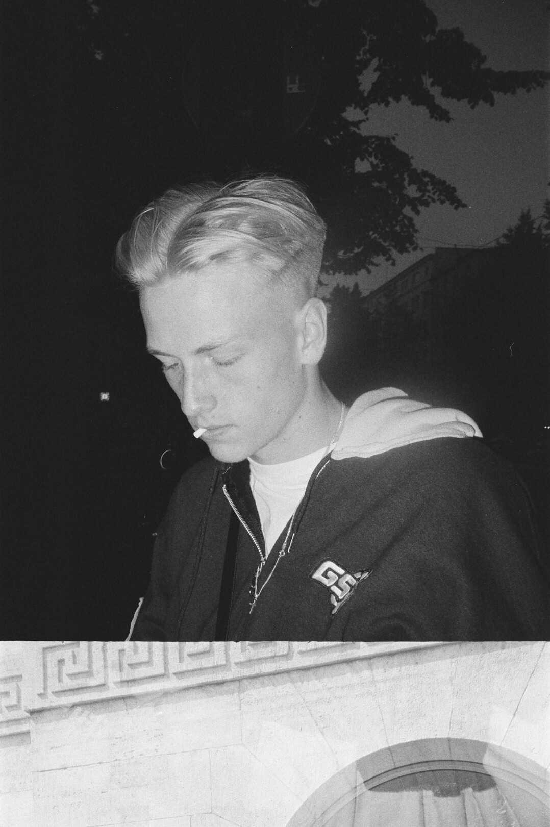 Portrait of a young man with short hair wearing a shirt