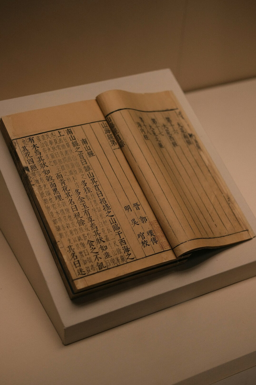 Notebook with handwritten research notes and a pen